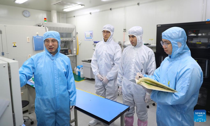 Sun Dongming (1st L) communicates with graduate students at a laboratory of the Institute of Metals of the Chinese Academy of Sciences in Shenyang, northeast China's Liaoning Province, Feb. 24, 2024. Photo: Xinhua
