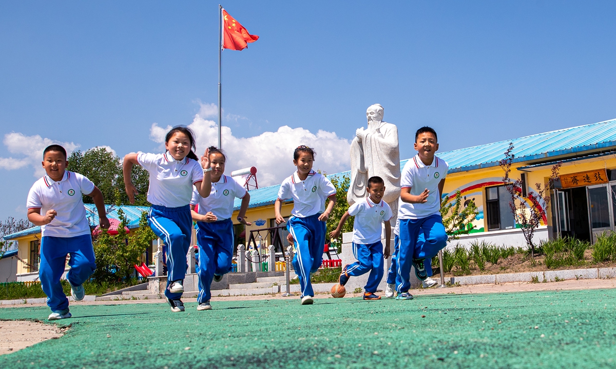 Children play on the playground at Xiaobaishan township central elementary school in Fengman district, Jilin, Northeast China's Jilin Province, on May 23, 2023. Photo: VCG