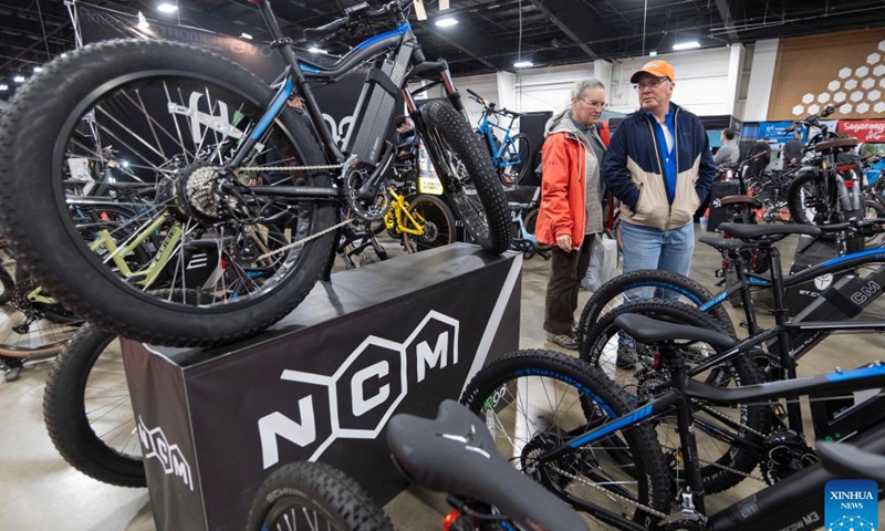 People visit the 2024 Toronto Bicycle Show and E-Bike Expo in Mississauga, the Greater Toronto Area, Canada, March 10, 2024. This annual event was held here from March 8 to 10, showcasing the latest products of more than 170 exhibitors. (Photo by Zou Zheng/Xinhua)