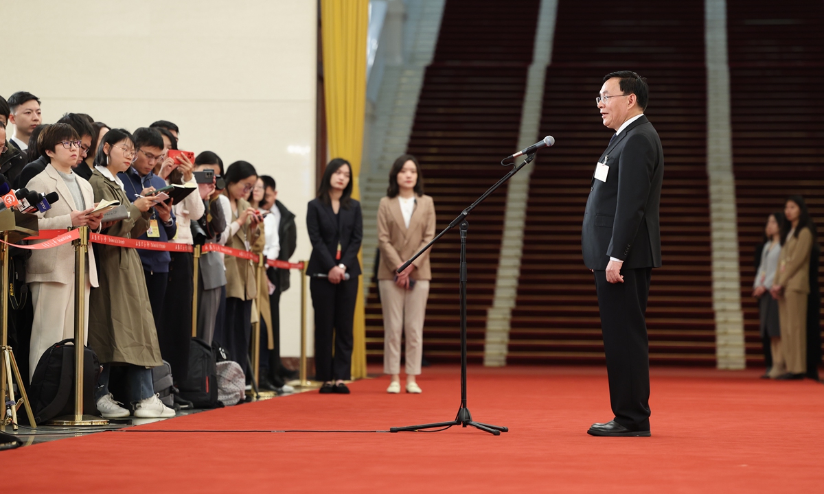 Zhang Yuzhuo, chairman of the State-owned Assets Supervision and Administration Commission of the State Council, gives an interview after the opening meeting of the second session of the 14th National People's Congress at the Great Hall of the People in Beijing, March 5, 2024.  Photo: VCG