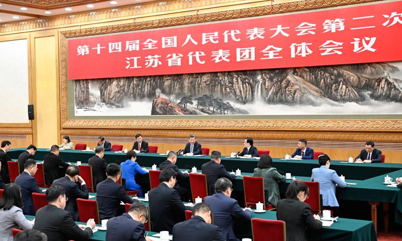 Chinese President Xi Jinping, also general secretary of the Communist Party of China Central Committee and chairman of the Central Military Commission, takes part in a deliberation with his fellow deputies from the delegation of Jiangsu Province at the second session of the 14th National People's Congress (NPC) in Beijing, capital of China, March 5, 2024. (Xinhua）