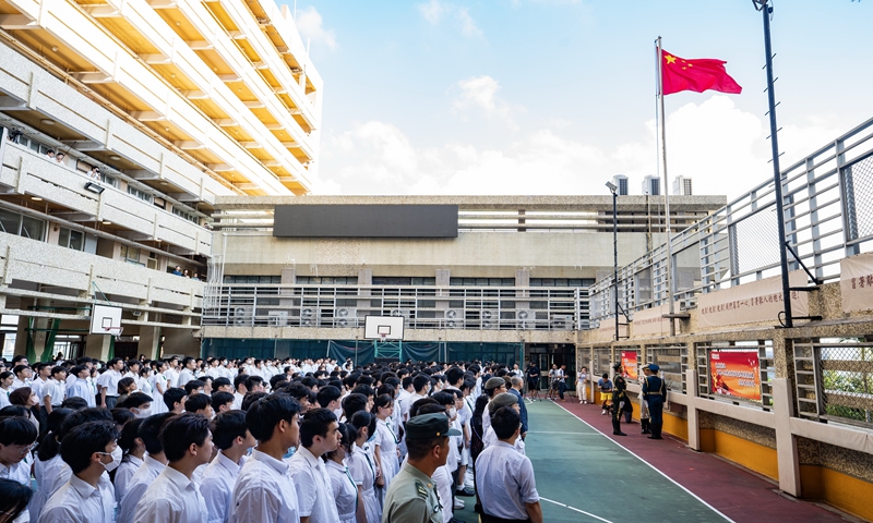 A local school in Hong Kong holds a flag-raising ceremony. Photo:IC