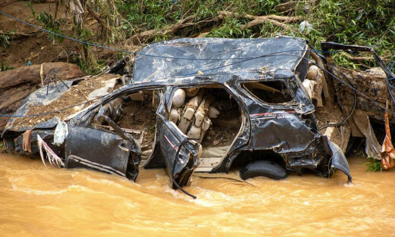 A vehicle is left damaged after heavy rains in Pesisir Selatan in West Sumatra, Indonesia, March 9, 2024. (Photo by Andri Mardiansyah/Xinhua)