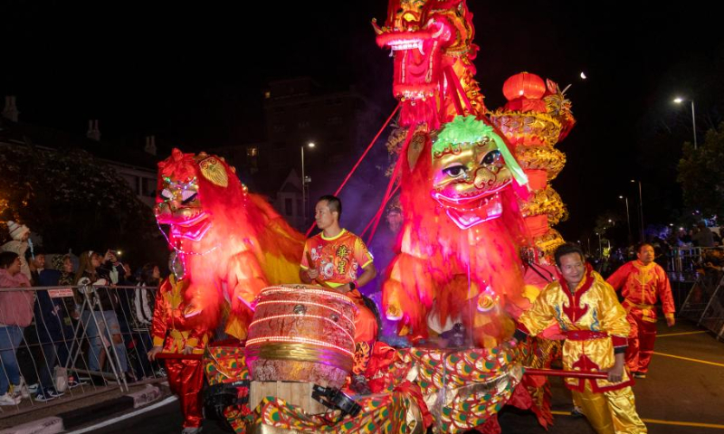 A float from a Chinese performing group parades during Cape Town Carnival 2024 in Cape Town, South Africa, on March 16, 2024. The annual Cape Town Carnival kicked off in the legislative capital of South Africa on Saturday evening with Chinese elements featured at the event. (Xinhua/Wang Lei)