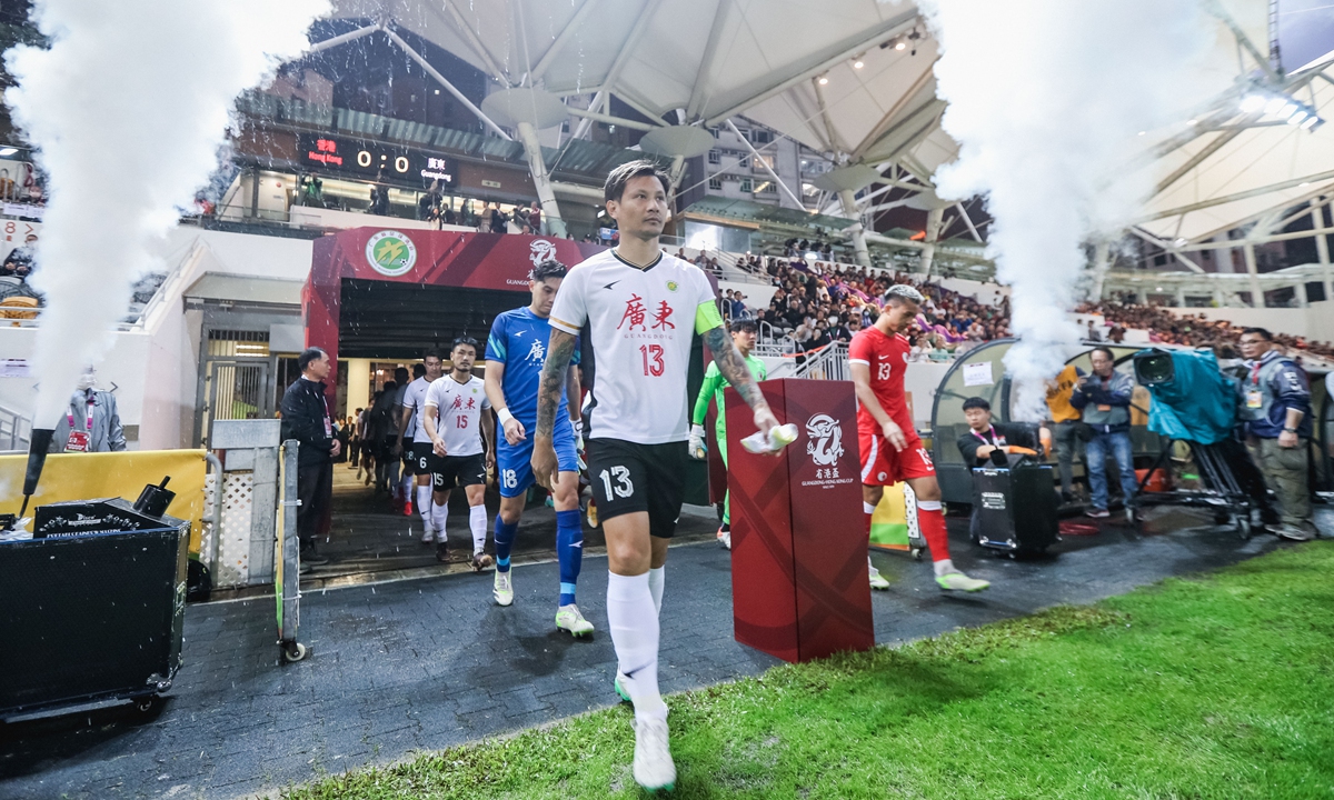 Players walk onto the pitch at the Guangdong-Hong Kong Cup soccer tournament in the Hong Kong Special Administrative Region. Photo: IC