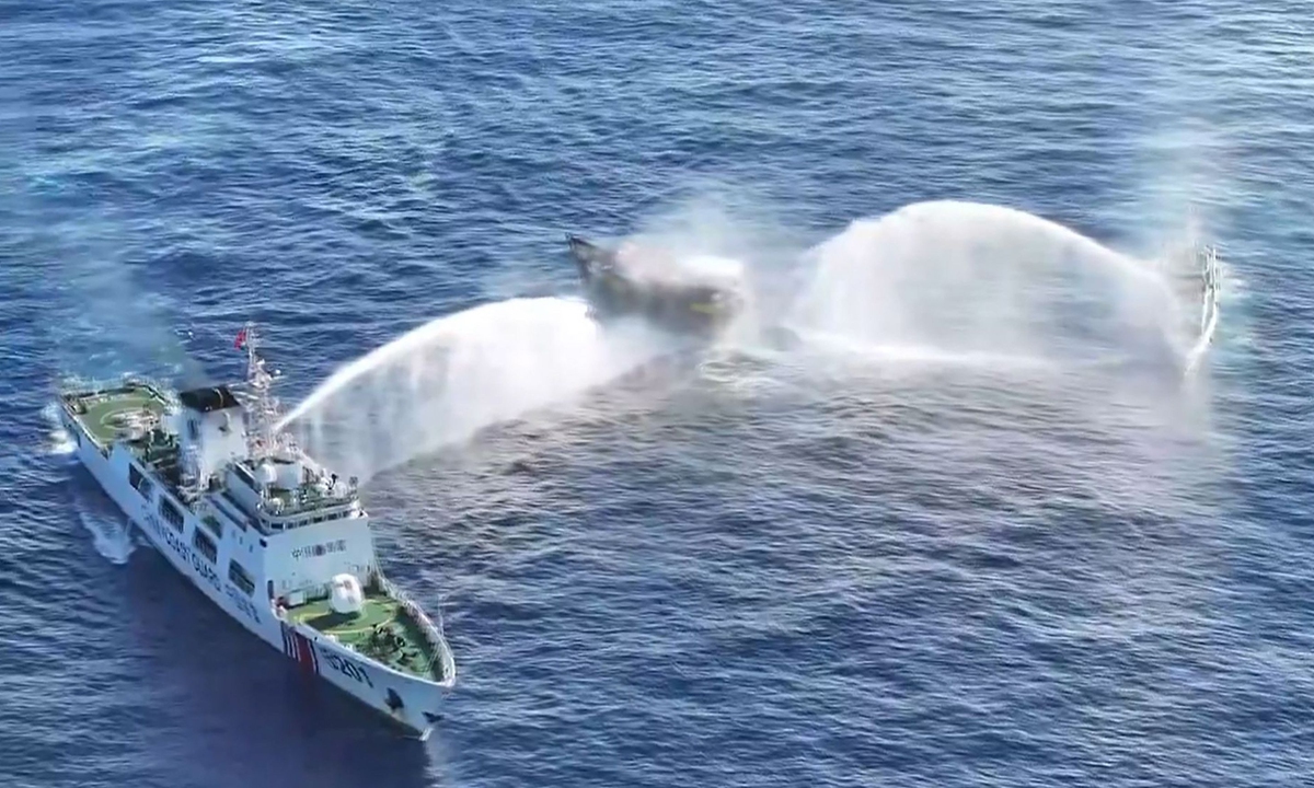 Two Chinese law enforcement ships issue warning shots with water cannon at a Filipino vessel in waters off China's Ren'ai Jiao (Reef) in the South China Sea on March 5, 2024, as it makes dangerous approach to China Coast Guard Ship. Photo: VCG