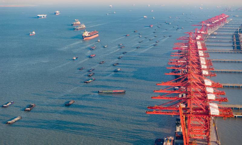 Cargo ships dock at and leave the Taicang Port in East China's Jiangsu Province on January 24, 2024. Photo: VCG