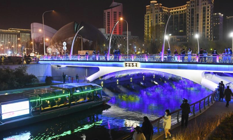 A boat sails in the Liangma River in Beijing, capital of China, March 16, 2024. A promotion event of the Liangma River was held on Saturday in Beijing.
The Liangma River traverses diverse areas, including foreign embassies, international hotels, department stores, and trendy commercial streets, connecting various international business districts in Beijing.
In 2019, the city's Chaoyang District embarked on a waterfront project along the Liangma River. After two years of development and environmental improvements, the Liangma River has transformed from a mere waterway into a captivating aquatic landscape. It has now become a must-visit destination in Beijing. (Xinhua/Ju Huanzong)