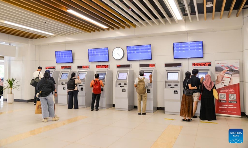 Passengers claim tickets from self-service ticketing machines at Halim Station in Jakarta, Indonesia, March 3, 2024. The Jakarta-Bandung High-Speed Railway (HSR), the first of its kind in Indonesia and Southeast Asia, has transported more than 2 million passengers in total, said China Railway International Limited on Sunday.(Photo: Xinhua)