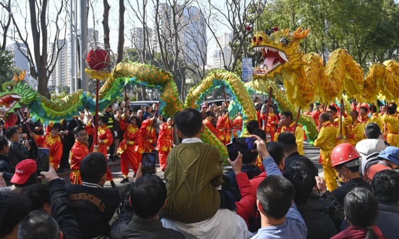 Folk artists holding cloth dragons take part in a parade in celebration of the upcoming Longtaitou Day in Fenghua, east China's Zhejiang Province, March 10, 2024. Fenghua Cloth Dragon, one of the country's most representative dragon dances, was listed as a national intangible cultural heritage in 2006.

A grand parade was organized in Fenghua on Sunday, one day ahead of the traditional Longtaitou Day, literally meaning dragon raises head, to celebrate the occasion. (Xinhua/Huang Zongzhi)