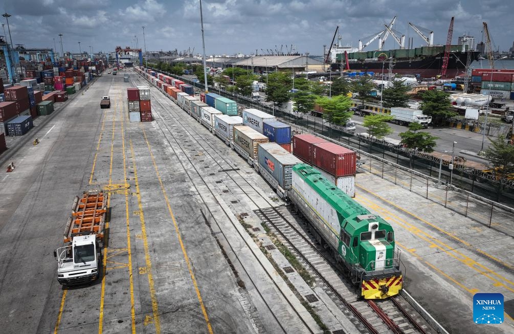 An aerial drone photo taken on March 2, 2024 shows freight trains waiting to be unloaded at Apapa port in Lagos, Nigeria. Built by China Civil Engineering Construction Corporation (CCECC), the Lagos-Ibadan Railway connects Nigeria's economic center Lagos and the southwest industrial city Ibadan.(Photo: Xinhua)