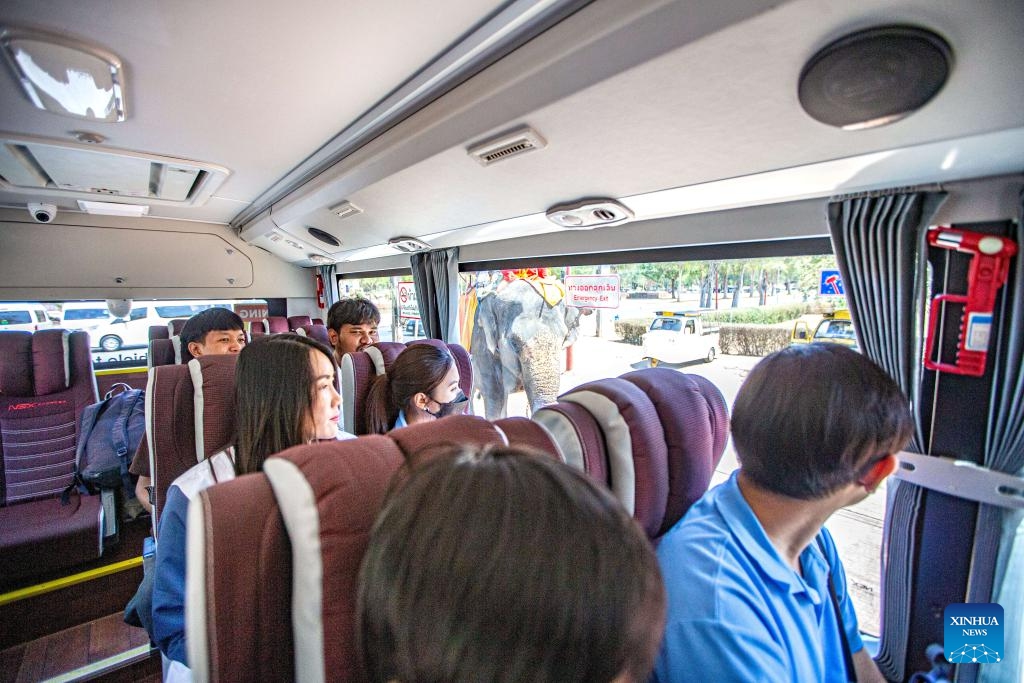 Passengers sit in an autonomous electric bus powered by 5G technology in Ayutthaya, Thailand, March 5, 2024. An autonomous electric bus powered by 5G technology has recently started trial operation in the city of Ayutthaya. The bus seats 20 passengers and will end its trial run in July.(Photo: Xinhua)