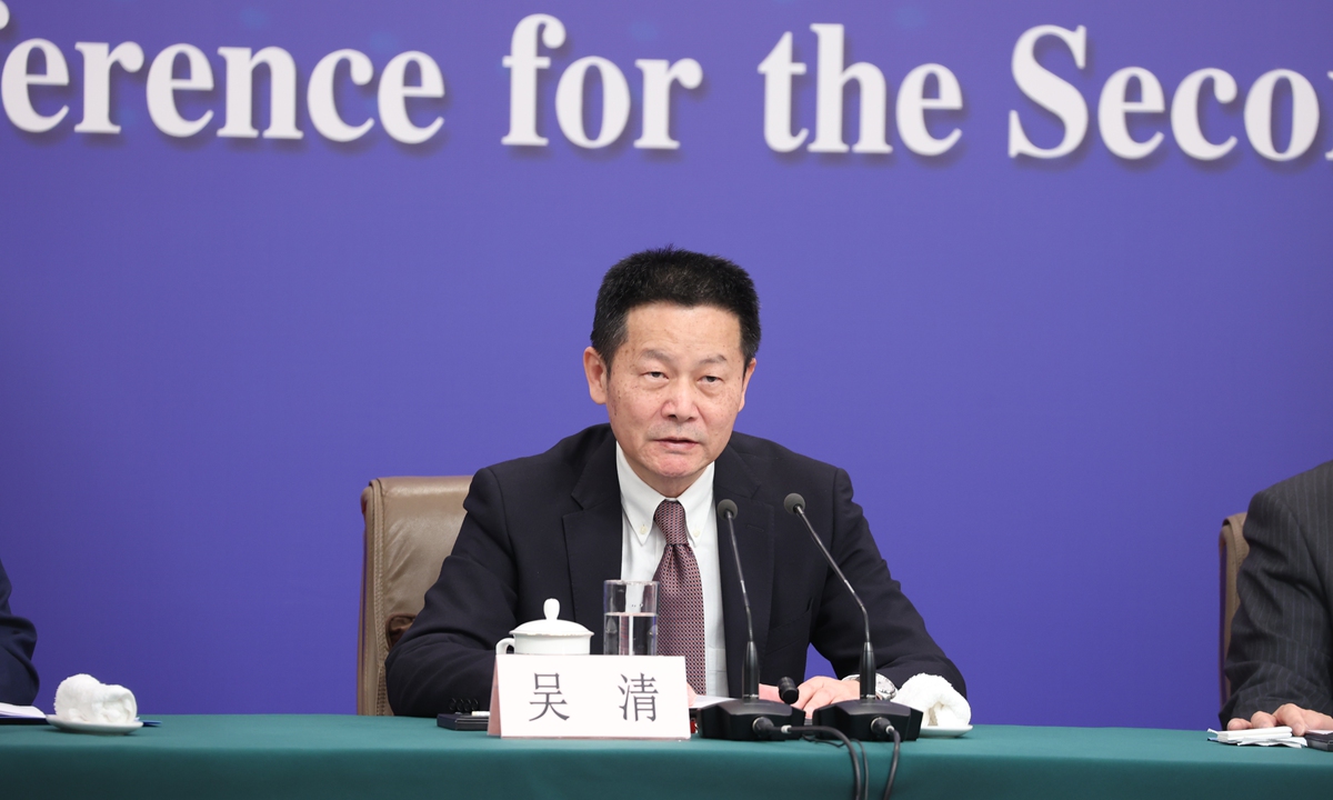 Wu Qing, chairman of the CSRC, China's top securities regulator, speaks to media at a press conference during the two sessions on March 6, 2024. Photo: VCG