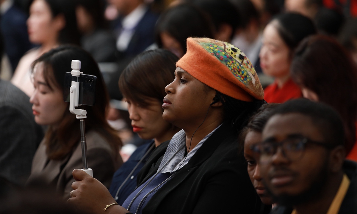 A foreign journalist uses mobile phone to livestream the press conference on China's economy for the second session of the 14th National People's Congress in Beijing on March 6, 2024. Photo: VCG