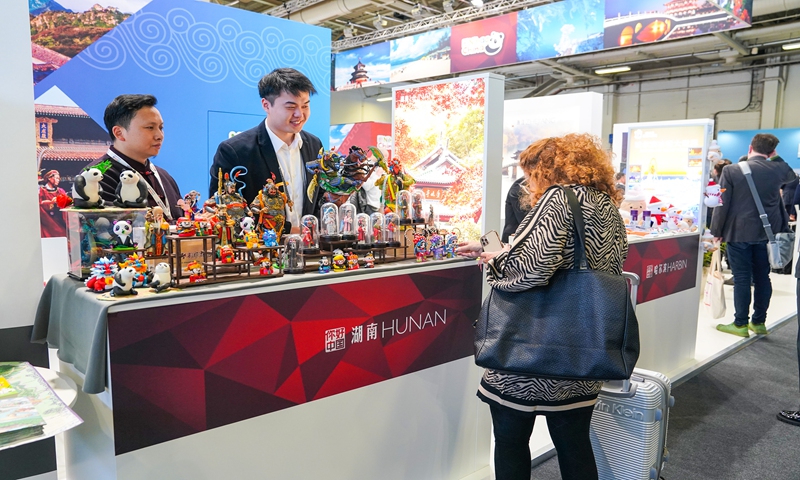 A visitor browses products from Central China's Hunan Province at the booth of China of the ITB Berlin travel trade show (local time) in Berlin, Germany on March 5, 2024. Nearly 100 Chinese delegates from 13 provinces and cities participated in the exhibition. Photo: VCG