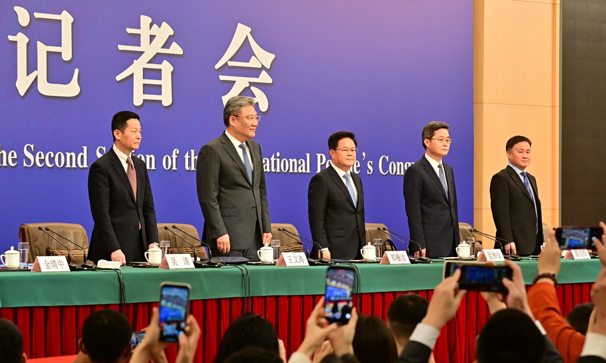 Zheng Shanjie (center), director of the National Development and Reform Commission, Lan Fo'an (second from right), minister of finance, Wang Wentao (second from left), minister of commerce, Pan Gongsheng (first from right), governor of the People's Bank of China, and Wu Qing, chairman of the China Securities Regulatory Commission, attend a press conference on China's economy for the second session of the 14th National People's Congress in Beijing on March 6, 2024. Photo: VCG