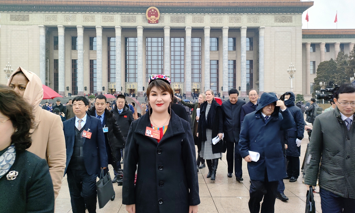 Rukeyamu Maitisaidi, an NPC deputy from Northwest China's Xinjiang Uygur Autonomous Region, stands outside the Great Hall of the People in Beijing on March 5. Photo: Courtesy of Rukeyamu Maitisaidi
