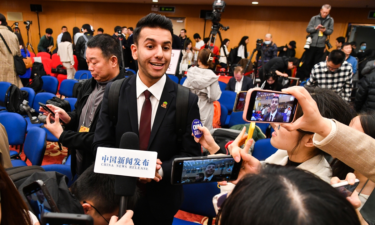 Ameen Muneer Mohammed, a reporter with Dubai-based China Arab TV, is interviewed by journalists after a press conference about China's foreign policy and foreign relations held on the sidelines of the second session of the 14th National People's Congress (NPC) in Beijing on March 7, 2024. Photo: VCG