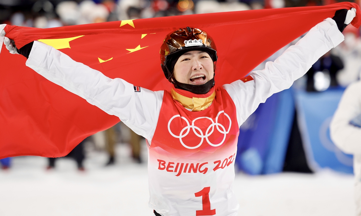 Chinese skier Xu Mengtao celebrates her victory with a national flag after winning the Beijing 2022 Winter Olympics Freestyle Skiing Women's Aerials Final, in Zhangjiakou, North China's Hebei Province, on February 14, 2022. Photo: VCG  