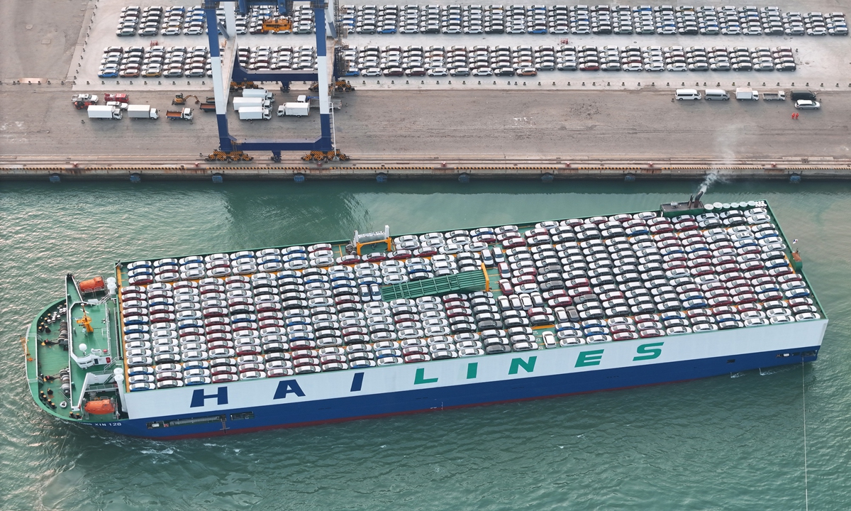 A cargo ship loaded with vehicles for overseas markets departs from Yantai Port in East China's Shandong Province on March 11, 2024. In the first two months of the year, China exported 822,000 vehicles, a year-on-year increase of 30.5 percent, data from the China Association of Automobile Manufacturers showed. Photo: cnsphoto