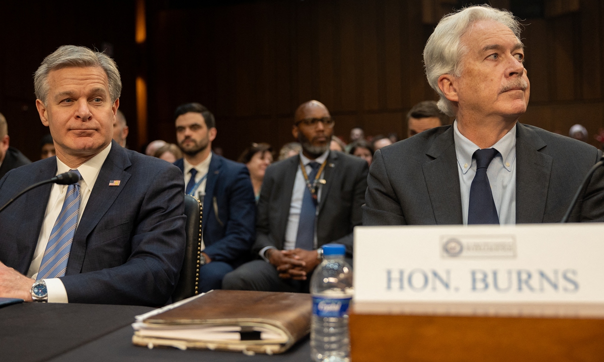 Federal Bureau of Investigations Director Christopher Wray and Central Intelligence Agency Director William Burns prepare to testify during a Senate Select Intelligence Committee hearing on Worldwide Threats on March 11, 2024 in Washington, DC.Photo:AFP