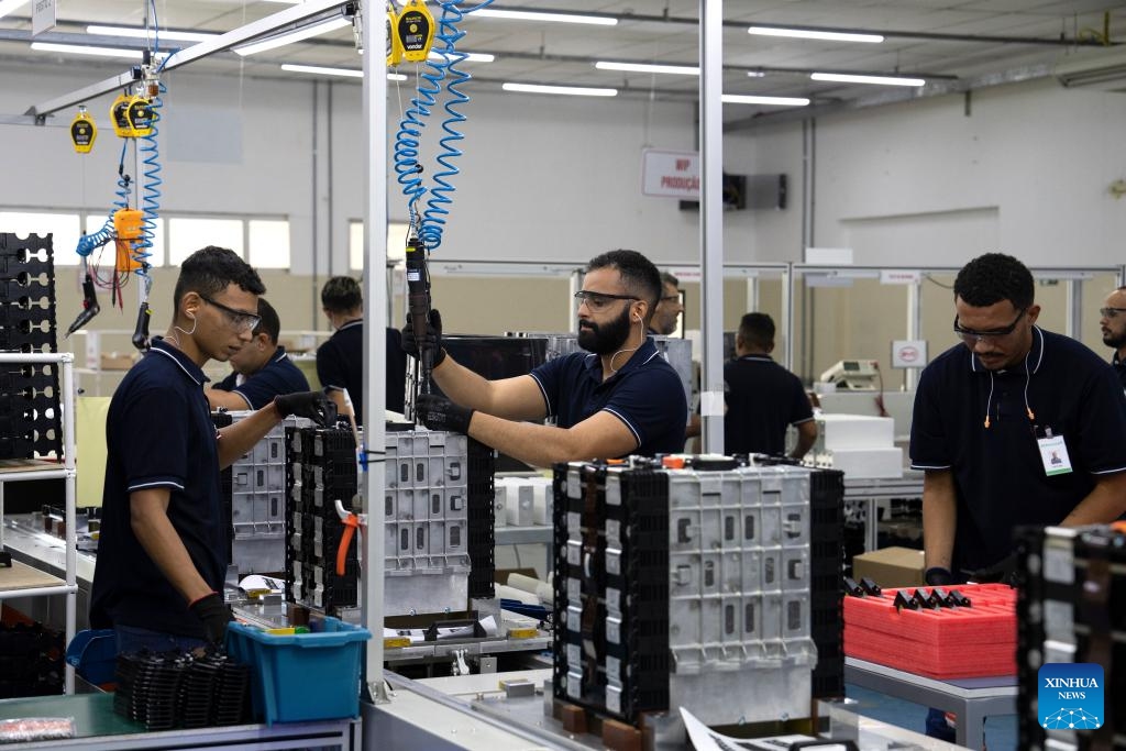 Workers operate on the production line at the BYD battery factory in Manaus, capital of Amazonas state, Brazil, March 12, 2024. BYD Brazil was established in 2014. In addition to marketing zero-emission electric forklifts, trucks, vans, and passenger cars in the Brazilian market, the company has set up the electric bus chassis factory and solar panel factory located in Campinas, as well as the battery factory located in Manaus to meet local market demands.(Photo: Xinhua)