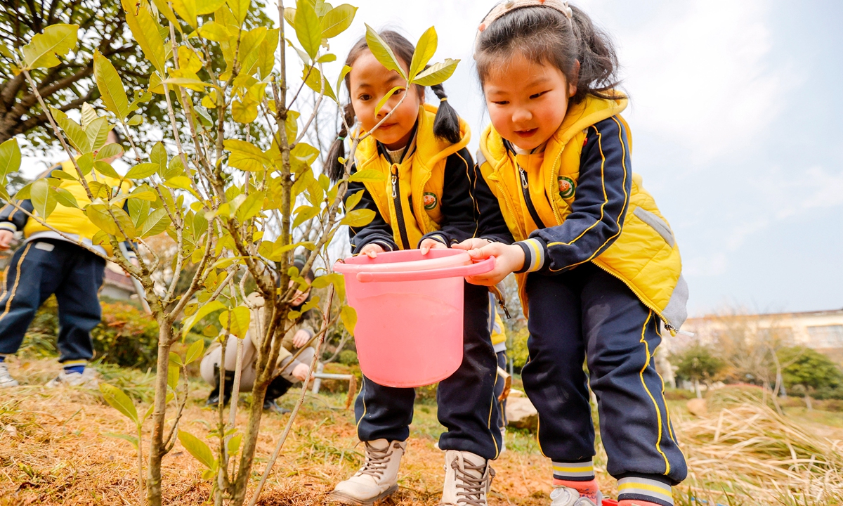 Children from the kindergarten in Xiajiang county water the newly planted saplings in the park on March 11, 2024, in Ji'an, South China's Jiangxi Province.Photo: VCG