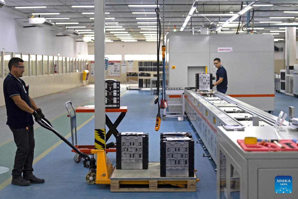 Workers operate on the production line at the BYD battery factory in Manaus, capital of Amazonas state, Brazil, March 12, 2024. BYD Brazil was established in 2014. In addition to marketing zero-emission electric forklifts, trucks, vans, and passenger cars in the Brazilian market, the company has set up the electric bus chassis factory and solar panel factory located in Campinas, as well as the battery factory located in Manaus to meet local market demands.(Photo: Xinhua)