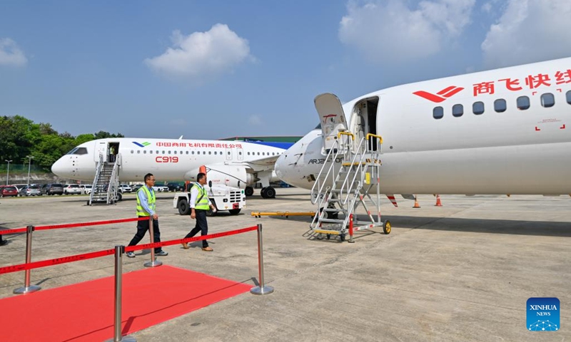 This photo taken on March 13, 2024 shows commercial aircraft ARJ21 (R) and C919, manufactured by Commercial Aircraft Corporation of China, Ltd. (COMAC), on display at the Sultan Abdul Aziz Shah Airport in Selangor state, Malaysia. The static display and demonstration flight of the China-manufactured commercial aircraft ARJ21 and C919 were held here on Wednesday.(Photo: Xinhua)