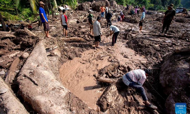 People carry out search operation after floods and landslides at Pesisir Selatan Regency in West Sumatra, Indonesia, March 13, 2024. The death toll from floods and landslides in the Indonesian province of West Sumatra has risen to 32, the country's National Disaster Mitigation Agency reported on Tuesday.(Photo: Xinhua)
