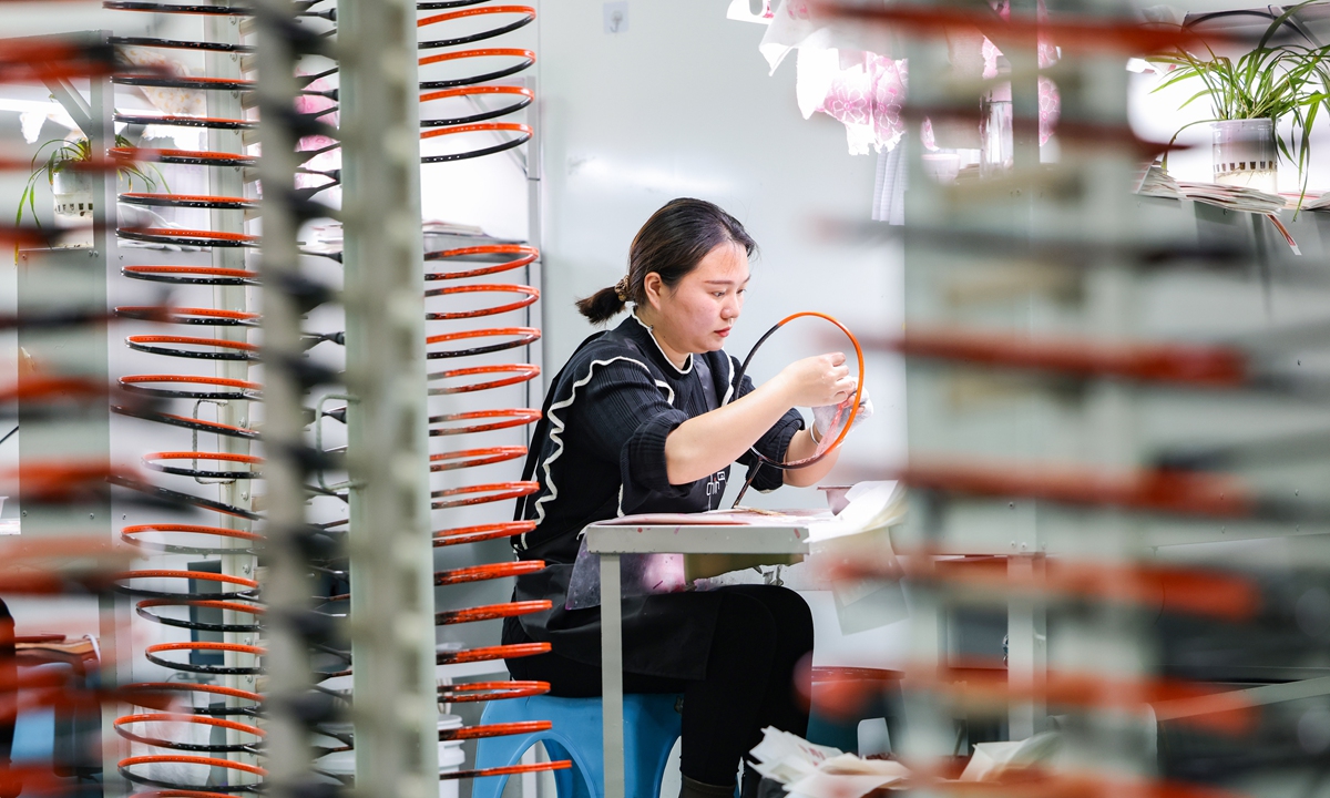 A worker at a sports gear company makes badminton rackets at a plant in Southwest China's Guizhou Province on March 18, 2024. China's exports in the first two months rose 10.3 percent to 3.75 trillion yuan ($520 billion) and got off to a good start in the new year, customs data showed. Photo: cnsphoto