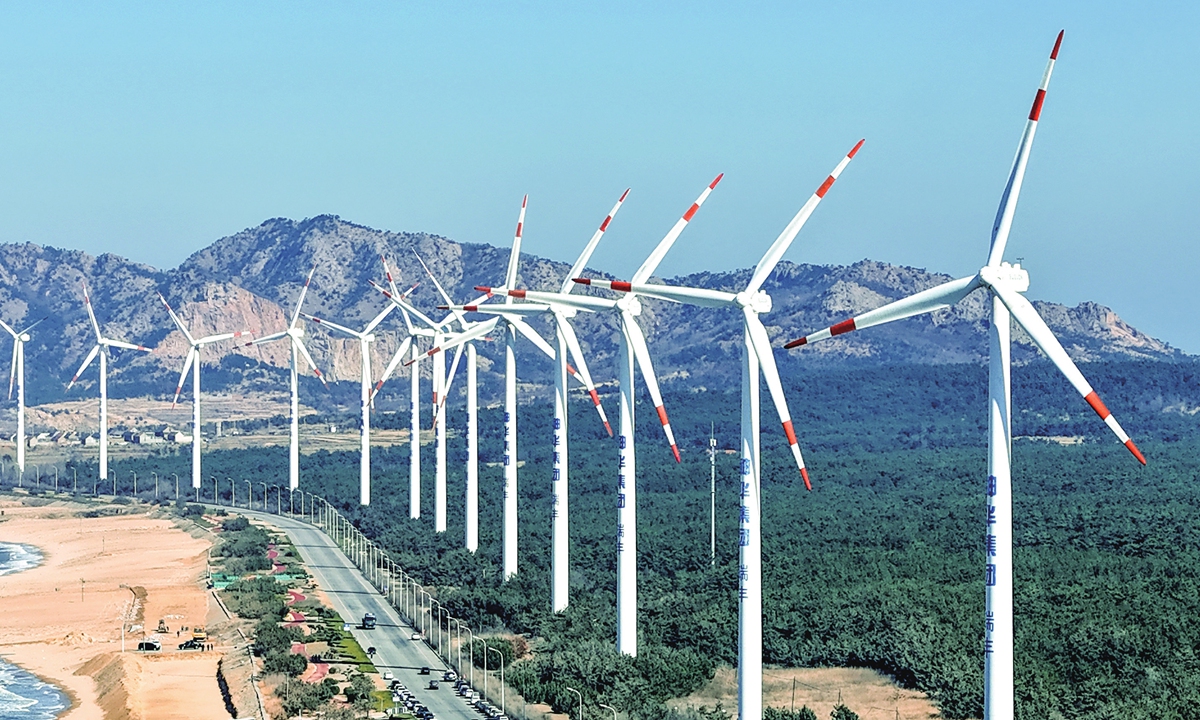A photo taken on March 19, 2024 shows wind turbines in a coastal area of Rongcheng city, East China's Shandong Province. The city, relying on its rich coastal wind energy resources, vigorously promotes the development of green and clean energy industries and optimizes the energy structure, in a bid to achieve ecological protection and sustainable development. Photo: VCG