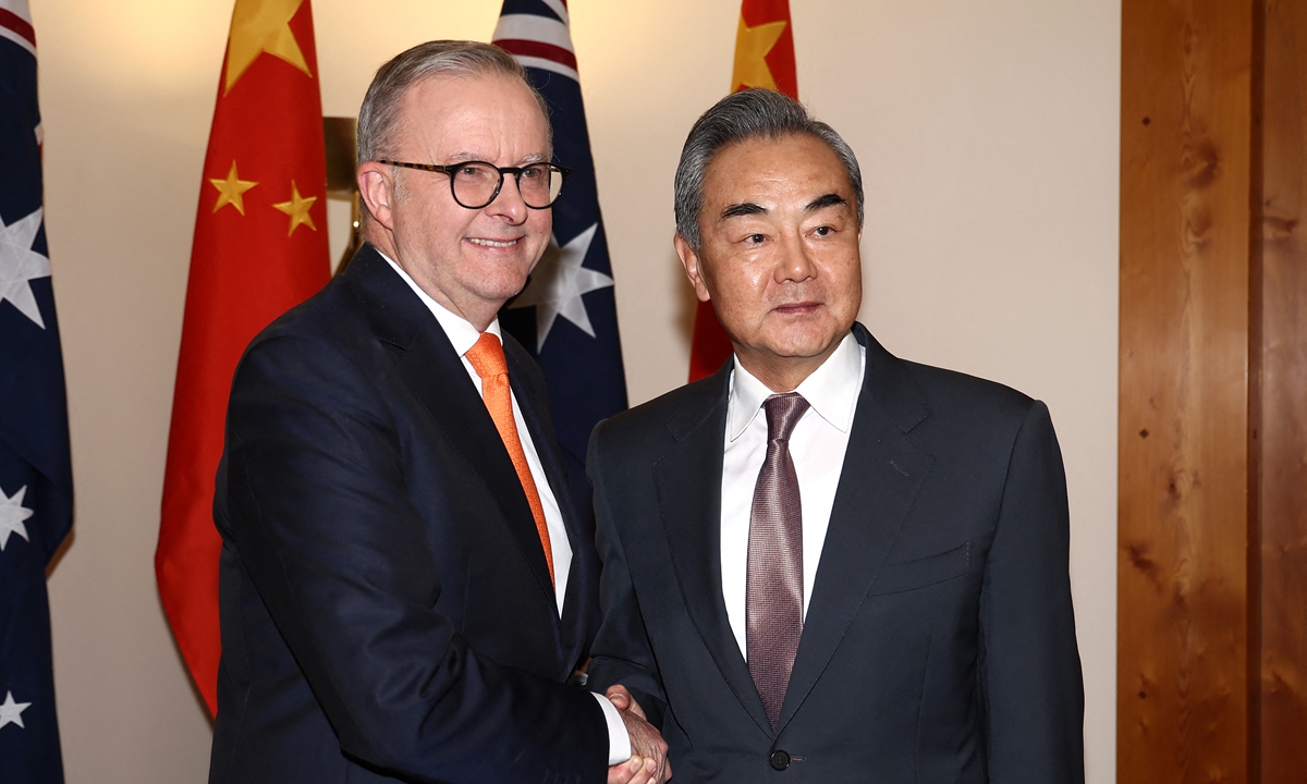 Chinese Foreign Minister Wang Yi, also a member of the Political Bureau of the Communist Party of China Central Committee, shakes hands with Australian Prime Minister Anthony Albanese during their meeting in Canberra on March 20, 2024. Photo: AFP
