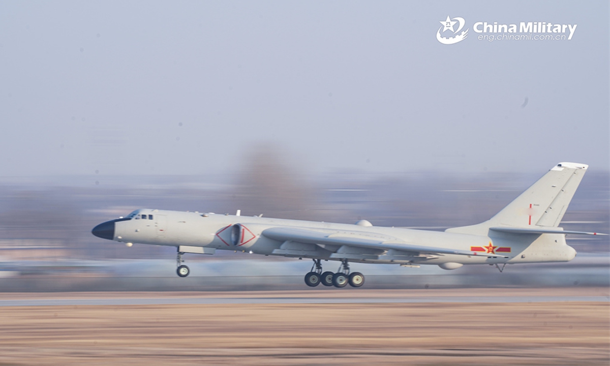 An H-6 bomber attached to an aviation regiment with the air force under PLA Central Military Command takes off during a round-the-clock penetrating strike training exercise. The exercise was held recently under complex weather conditions to temper the troops' combat capability. Photo: eng.chinamil.com.cn