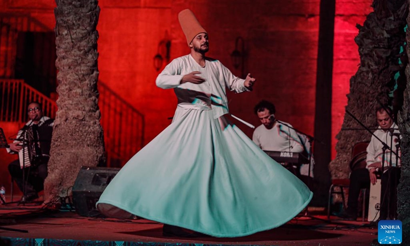 A dancer performs a Sufi dance at Prince Taz Palace during Ramadan in Cairo, Egypt, on March 19, 2024.(Photo: Xinhua)