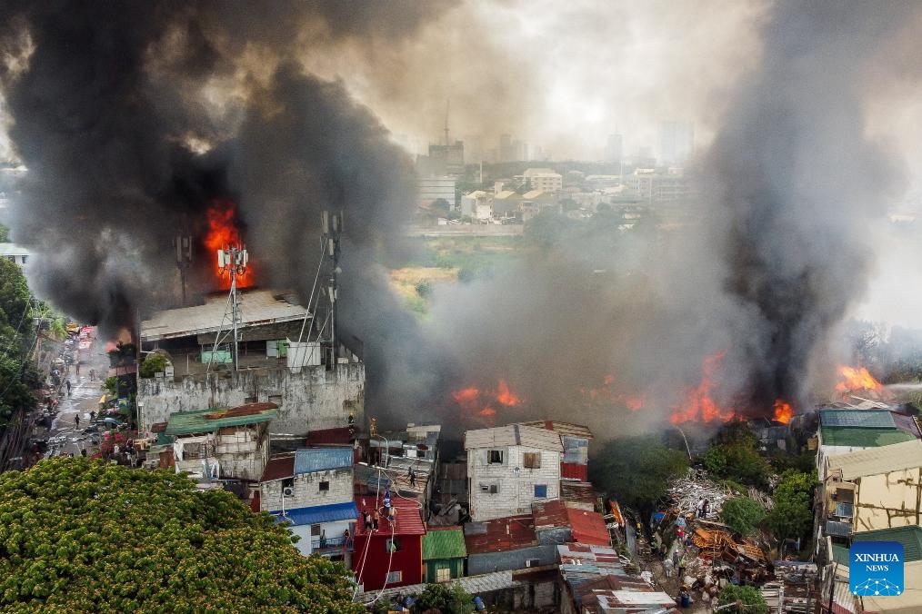 An aerial drone photo taken on March 19, 2024 shows a fire accident in Quezon City, the Philippines. Some 400 families were affected by a fire accident that took place in Quezon City on Tuesday, according to local officials.(Photo: Xinhua)