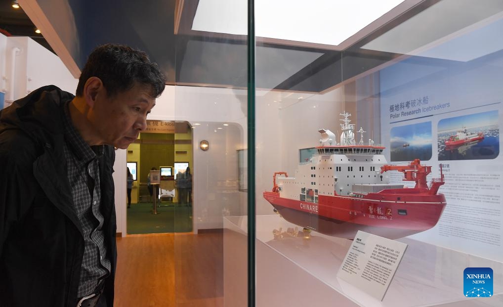 A visitor views a model of China's polar icebreaker Xuelong 2 at the Polar Research and Climate Change exhibition at Hong Kong Science Museum in Hong Kong, south China, March 19, 2024. Available to the public from March 18 till June 26, the exhibition will expose audiences to the scientific expeditions and research accomplishments of China's polar icebreaker Xuelong 2.(Photo: Xinhua)