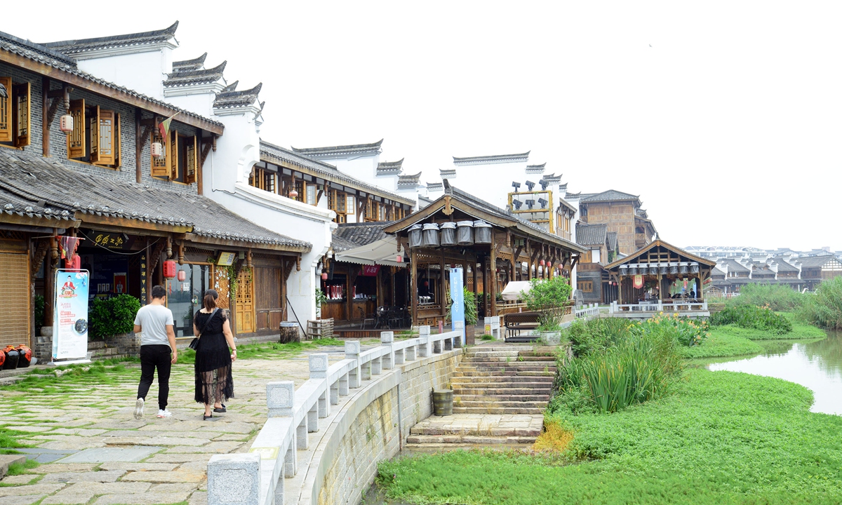 Tourists wander on the Riverside Street in Changde, Central China's Hunan Province. Photo: VCG