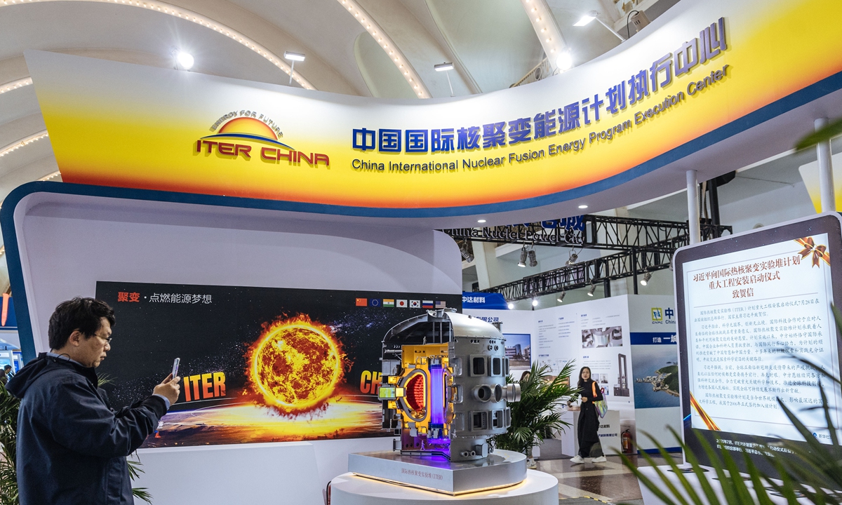 A man takes a photo of an exhibit at the 2024 China International Nuclear Industry Exhibition in Beijing on March 19, 2024. The 
exhibition is expected to attract the participation of more than 110 renowned domestic and international companies and over 10,000 professionals from more than 10 countries. Photo: Li Hao/GT