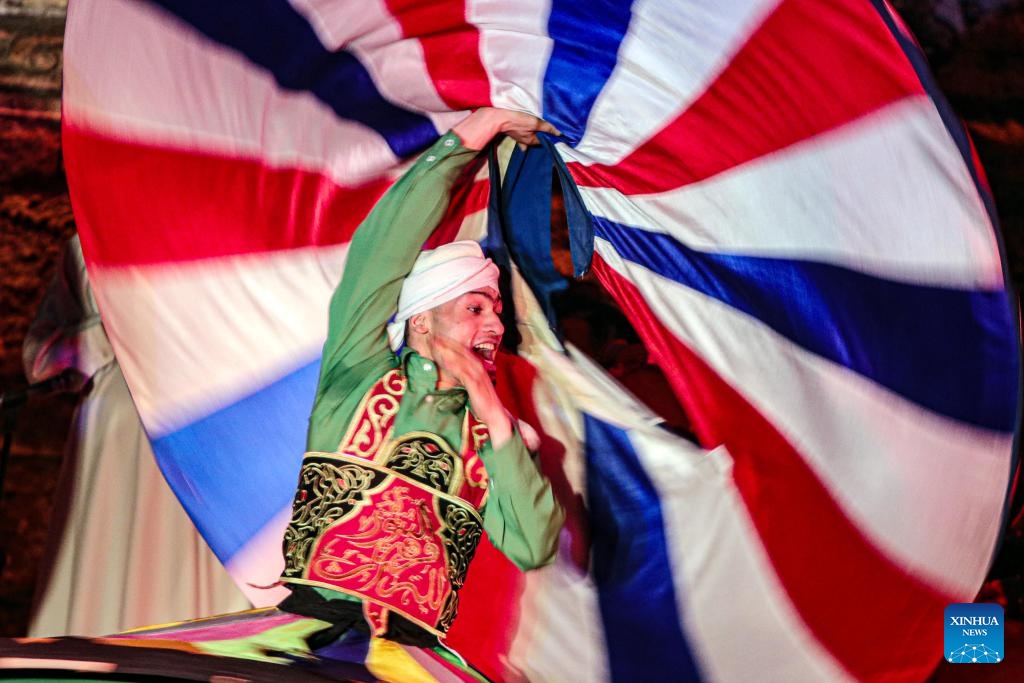 A dancer performs Tanoura, a traditional Egyptian folk dance, during the holy month of Ramadan at the Sultan Al-Ghuri complex in Cairo, Egypt, on March 20, 2024.(Photo: Xinhua)