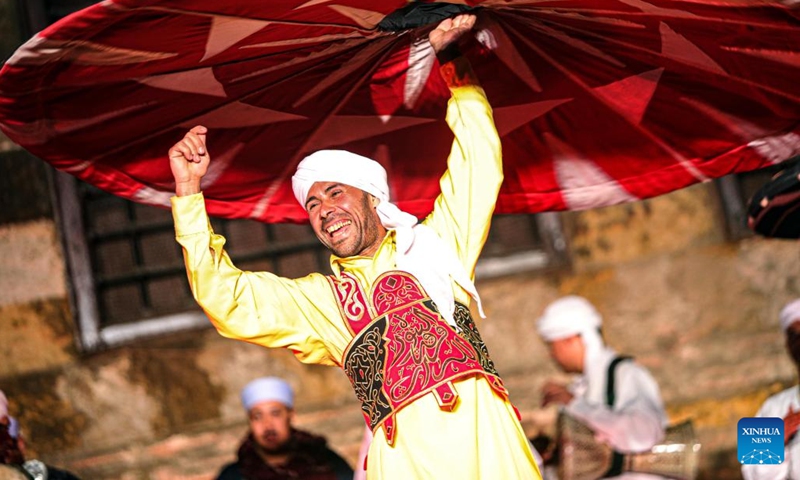 A dancer performs Tanoura, a traditional Egyptian folk dance, during the holy month of Ramadan at the Sultan Al-Ghuri complex in Cairo, Egypt, on March 20, 2024.(Photo: Xinhua)