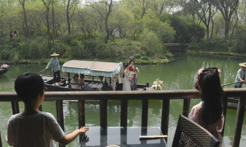 Performers in traditional costumes take a boat parade during the Huazhao Festival celebrations in Xixi Wetland in Hangzhou, east China's Zhejiang Province, March 24, 2024. The annual Huazhao Festival featuring a series of activities, including a boat parade and a folk ritual, was celebrated in Xixi Wetland on Sunday. (Xinhua/Weng Xinyang)