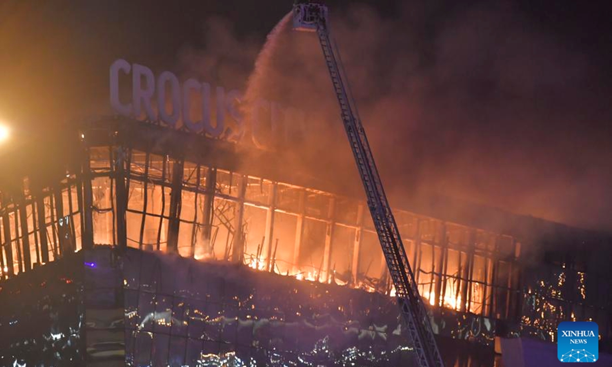 Rescuers battle a fire at the burning Crocus City Hall concert venue following a shooting incident in the northwest of Moscow, Russia, on March 22, 2024.(Photo by Alexander Zemlianichenko Jr/Xinhua)