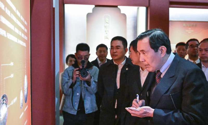 Ma Ying-jeou, former chairman of the Chinese Kuomintang party, takes notes while visiting Famen Temple in Famen Town of Fufeng County in Baoji City, northwest China's Shaanxi Province, April 5, 2024. A delegation of young people from Taiwan led by Ma visited Famen Temple on Friday. (Xinhua/Chen Yehua)