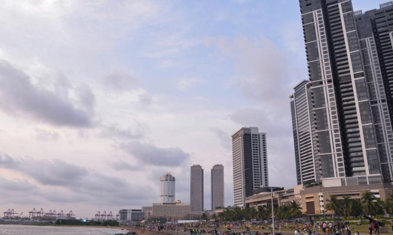 People are seen near the sea in Colombo, capital of Sri Lanka, March 29, 2024. (Xinhua/Xu Qin)