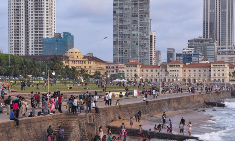 People are seen near the sea in Colombo, capital of Sri Lanka, March 29, 2024. (Xinhua/Xu Qin)