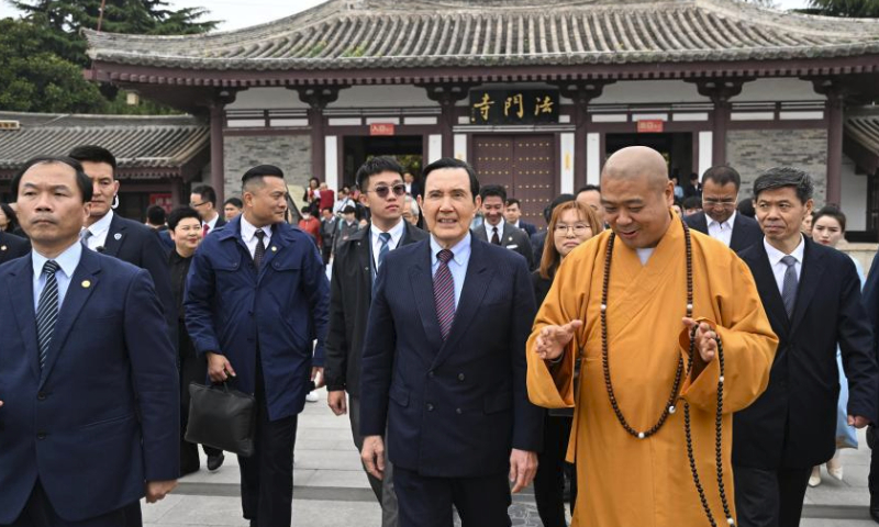 Ma Ying-jeou, former chairman of the Chinese Kuomintang party, and members of a delegation of young people from Taiwan visit Famen Temple in Famen Town of Fufeng County in Baoji City, northwest China's Shaanxi Province, April 5, 2024. A delegation of young people from Taiwan led by Ma visited Famen Temple on Friday. (Xinhua/Chen Yehua)