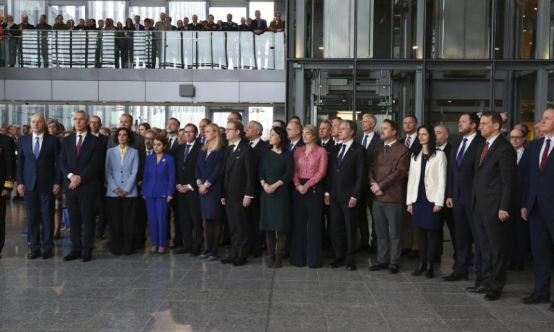 North Atlantic Treaty Organization (NATO) officials and attendees of a NATO foreign ministers meeting are pictured during a ceremony to mark the 75th anniversary of NATO at the NATO headquarters in Brussels, Belgium, April 4, 2024. NATO marked the 75th anniversary since the signing of the North Atlantic Treaty on Thursday. (Xinhua/Zhao Dingzhe)