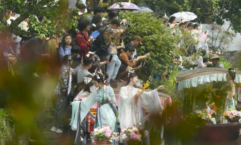 Performers in traditional costumes take a boat parade during the Huazhao Festival celebrations in Xixi Wetland in Hangzhou, east China's Zhejiang Province, March 24, 2024. The annual Huazhao Festival featuring a series of activities, including a boat parade and a folk ritual, was celebrated in Xixi Wetland on Sunday. (Xinhua/Weng Xinyang)