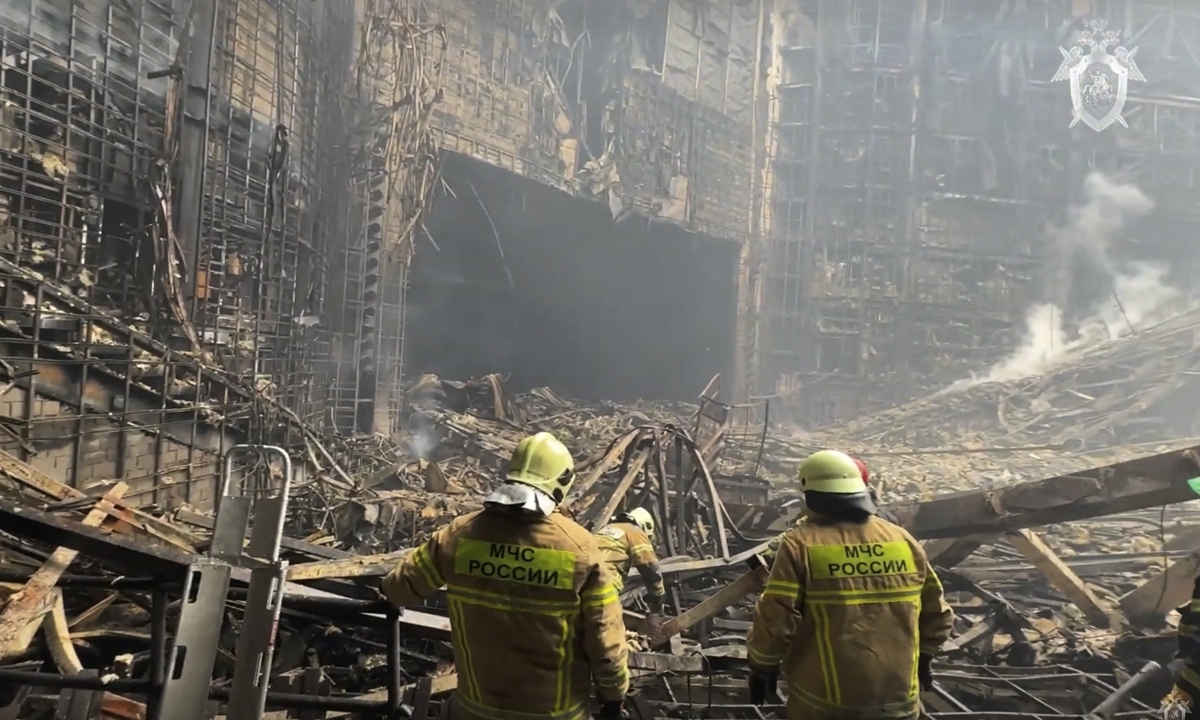 Firefighters work in the burned concert hall on March 23, 2024, after an attack on the building of the Crocus City Hall in Moscow's Krasnogorsk suburb, Russia, the day before. Photos: VCG